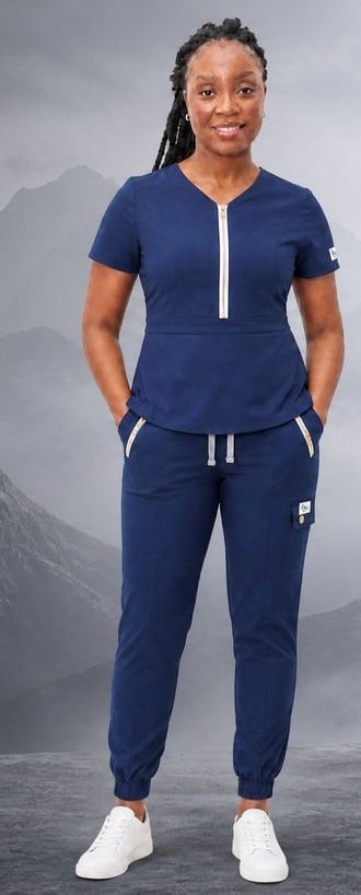 Black woman wearing the Classic V-Neck Scrub Set in Navy Blue.