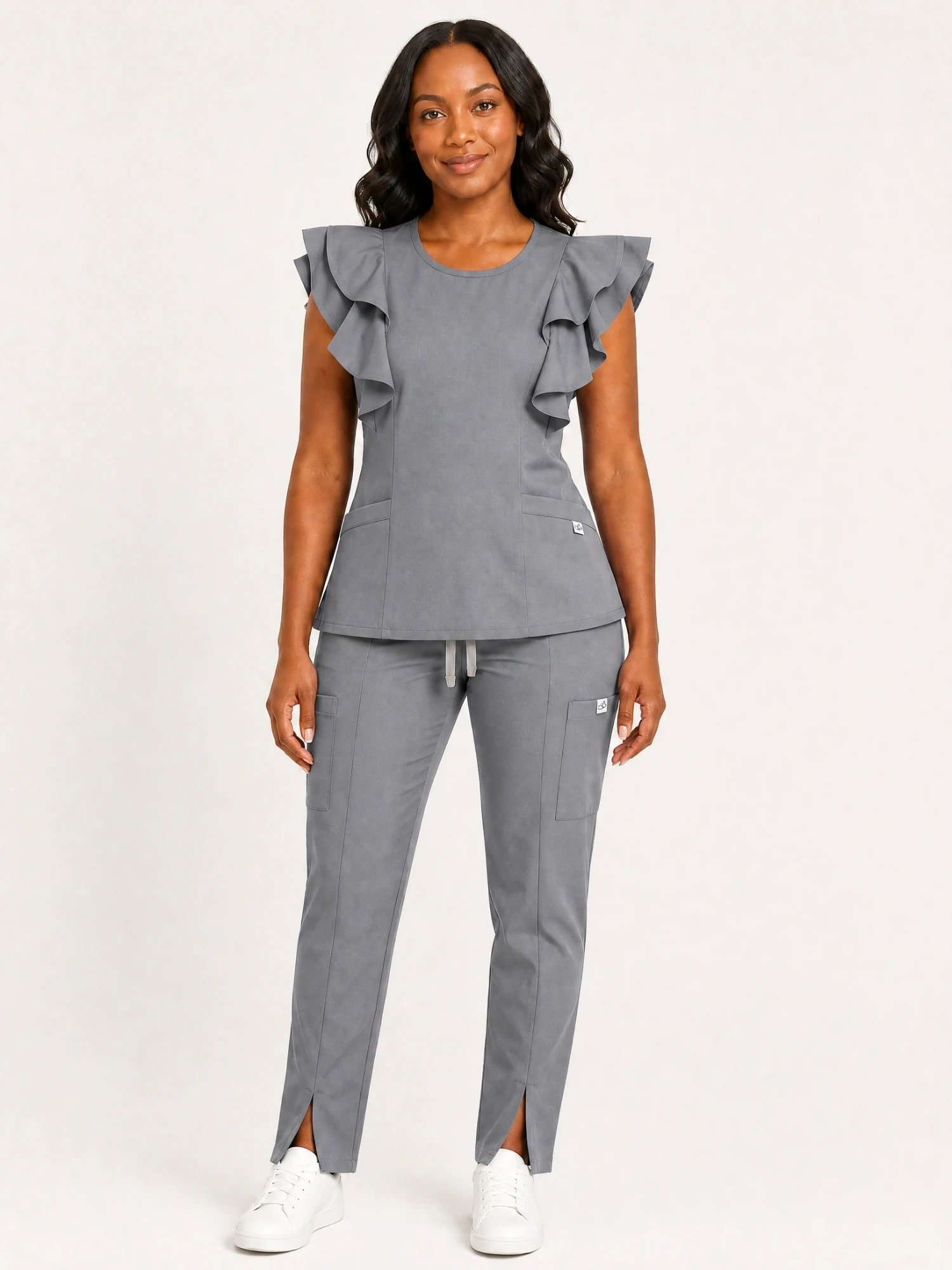 style3 grey swatch26 white front Black woman wearing the Yireh Fashion Flare Scrub Set in Grey, front view.