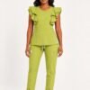 style3 lime olive swatch21 white front Black woman wearing the Yireh Fashion Flare Scrub Set in Lime Olive, front view.
